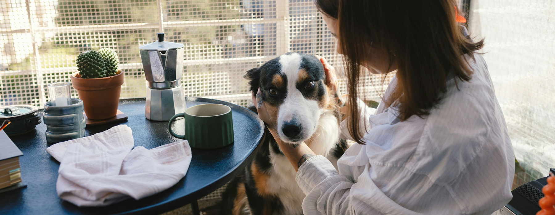 a woman and a dog outdoors
