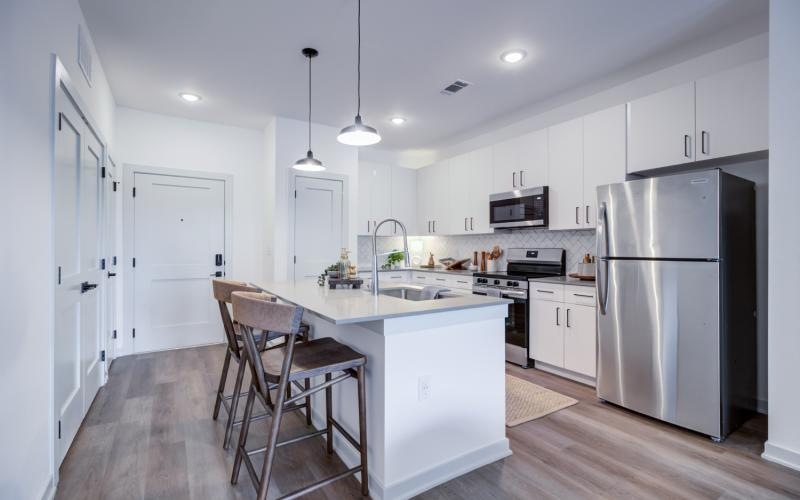 a kitchen with white cabinets