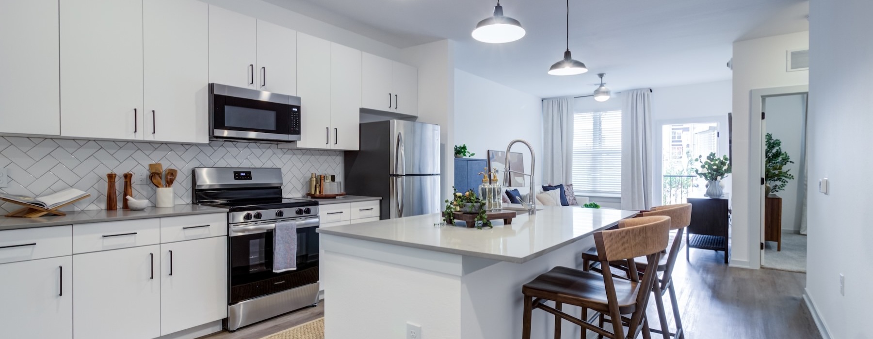 a kitchen with white cabinets